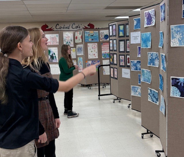 Students admire the artwork