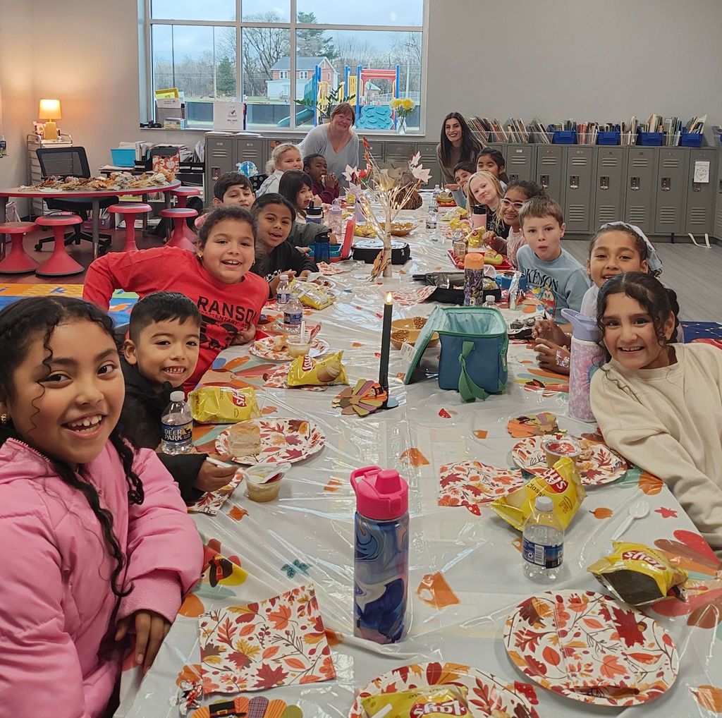 Mrs. Sutch's second grade class eating snacks at their Friendsgiving.