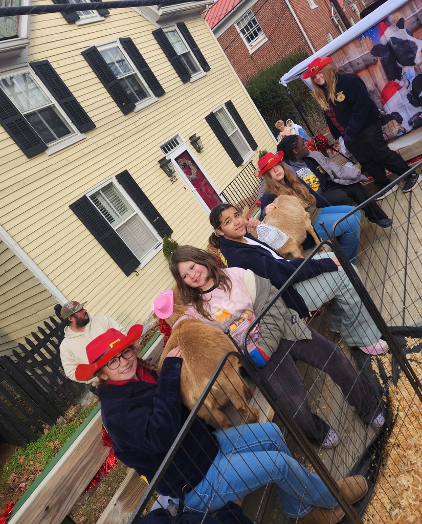 Students and animals wait for the Christmas Parade to begin.