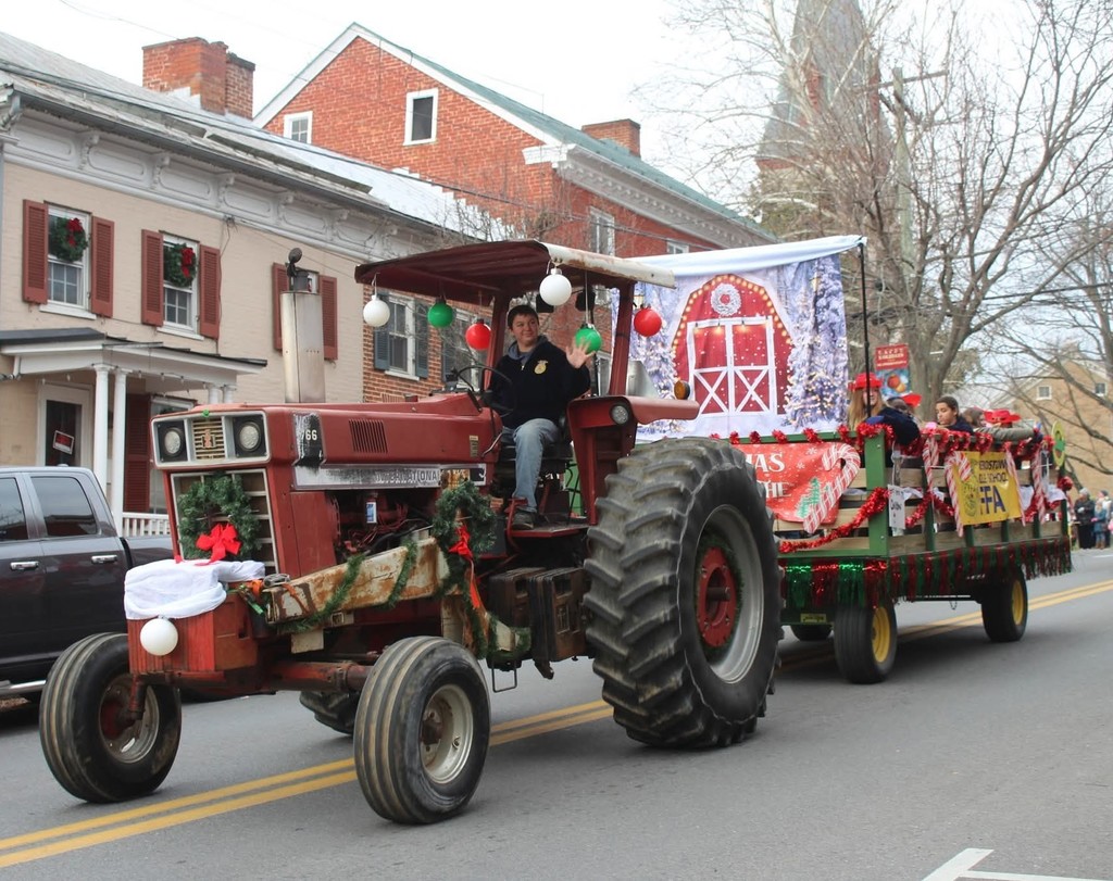 Hunter drives the big tractor that pulls the FFA float.