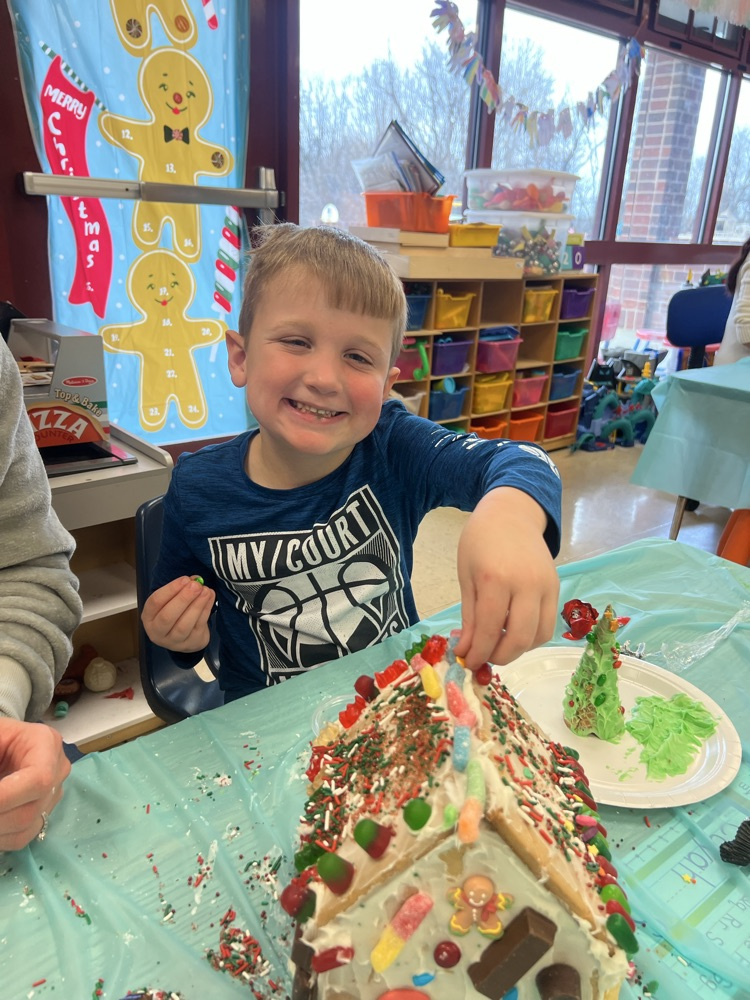 boy with gingerbread house