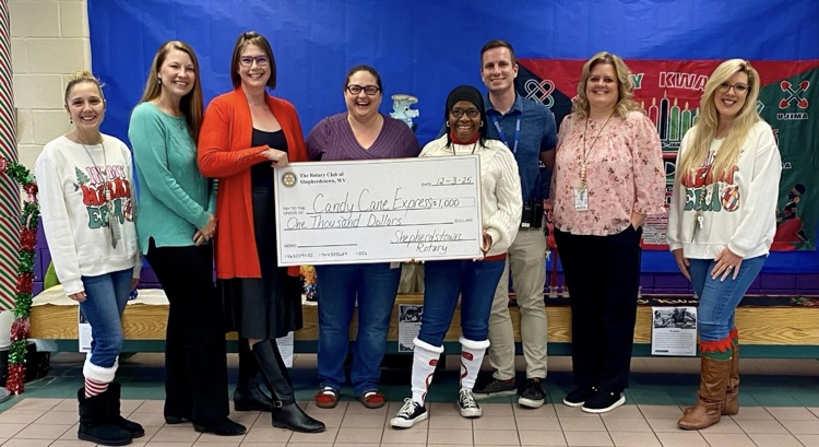 Candy Cane Express Donation Check with Rotary Members