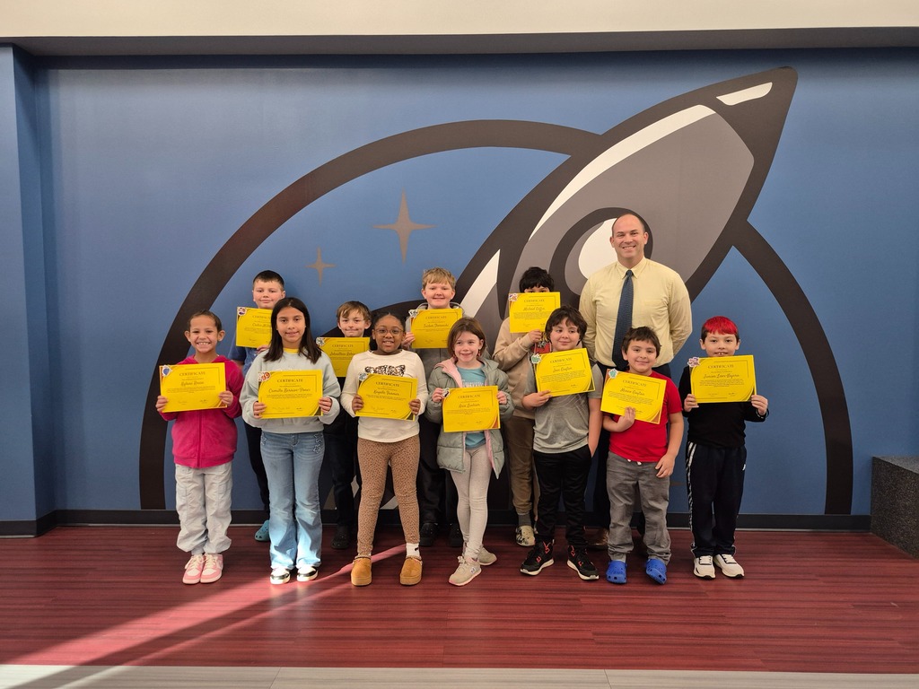 Students posing with Mr. Astorino with their certificates