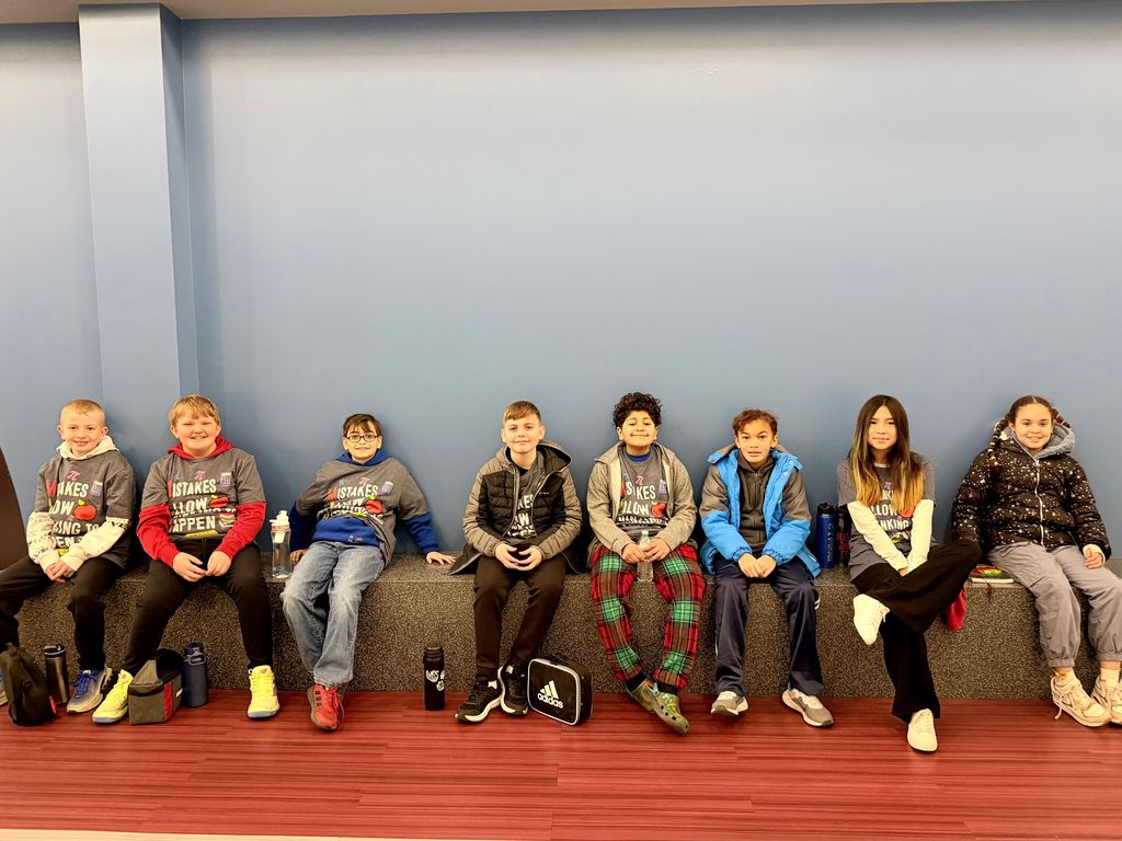 Fourth and fifth grade students sitting together