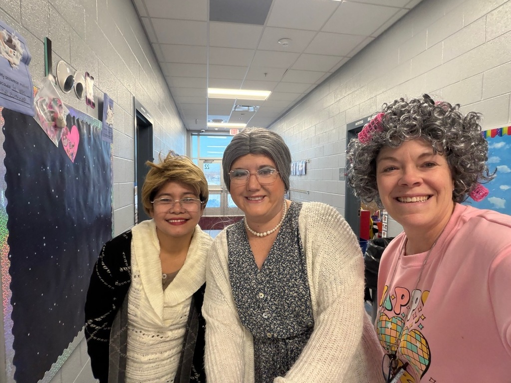 Kindergarten teachers dressed in gray wigs and glasses