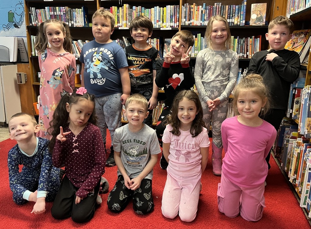 kindergarten students in pajamas in library
