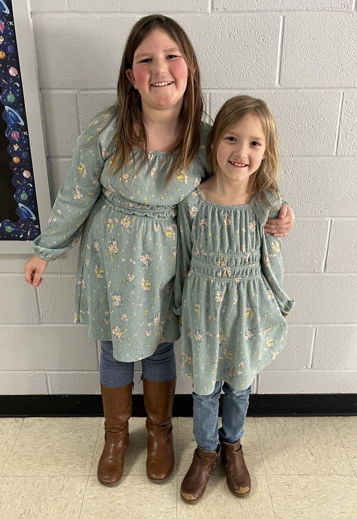 Two sisters dressed as twins for TWIN DAY