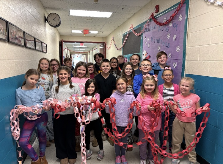 kids holding paper chains 