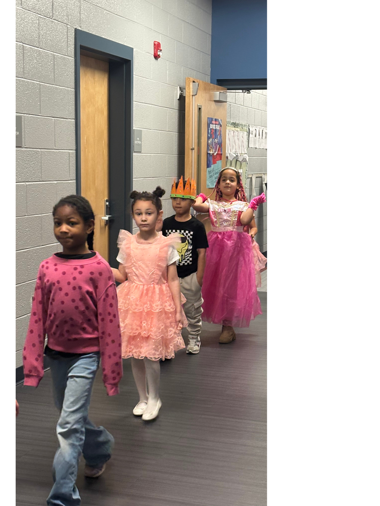 Students dressed up walking in a parade