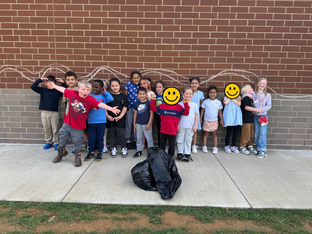Mrs. Mossburg's Kindergarten class posing after cleaning up trash