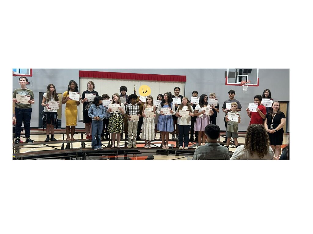 Mrs. Cruse's fifth grade class with their certificates