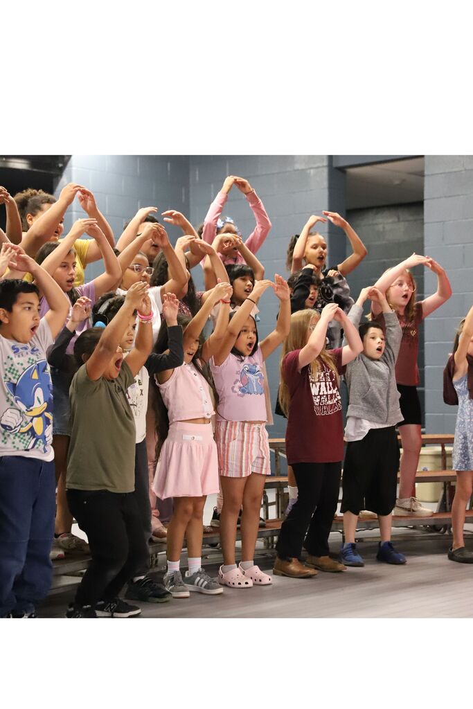 Third grade students performing a song