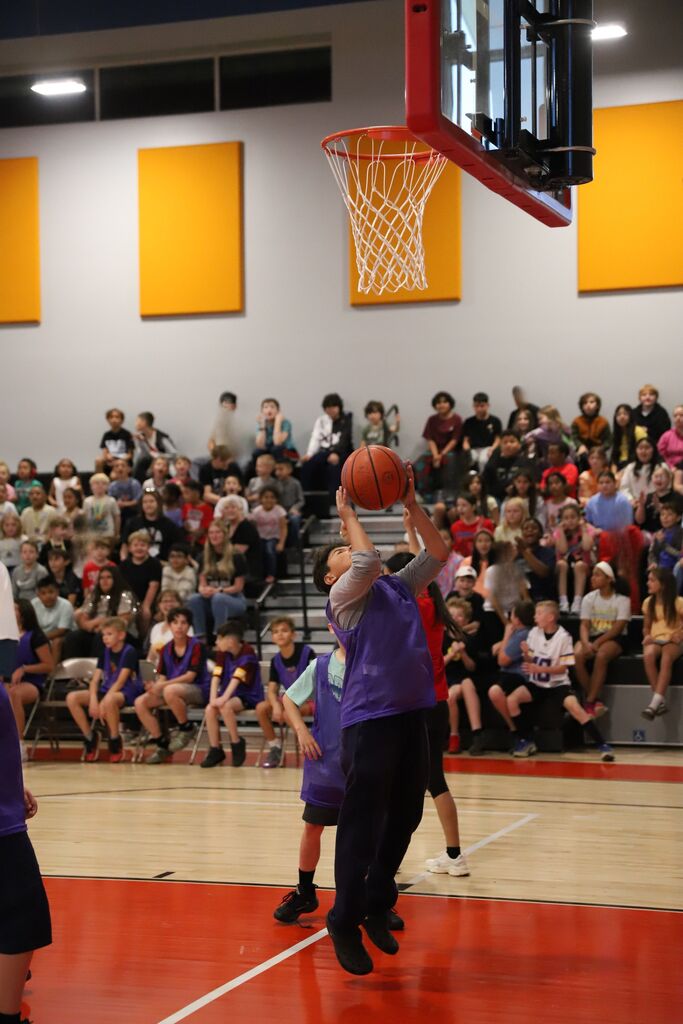 5th grade student shooting a basket