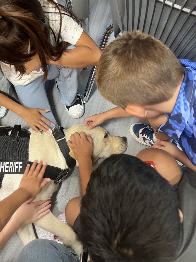 4th grade students petting K-9 Rugby
