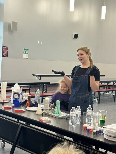 Parent and student displaying elephant toothpaste reaction