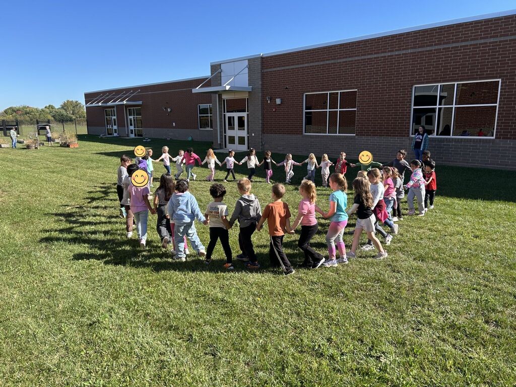 Kindergarten students playing Ring Around the Rosy