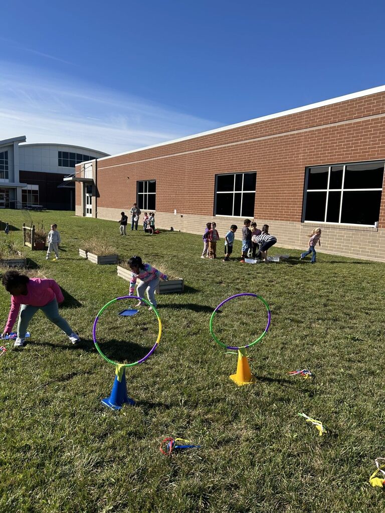 Kindergarten students playing at stations