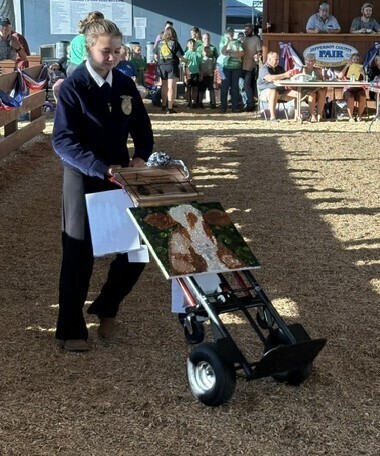 Student showing FFA bake item