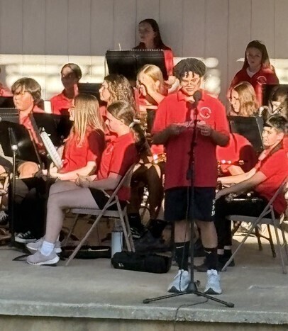 Student announcing a song