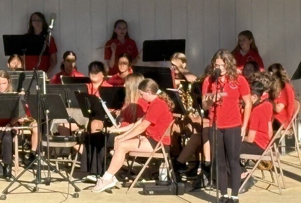 Student announcing a song