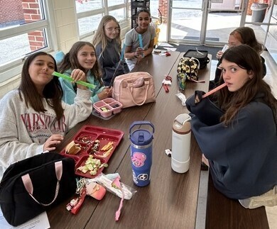Students eating popsicles at lunch