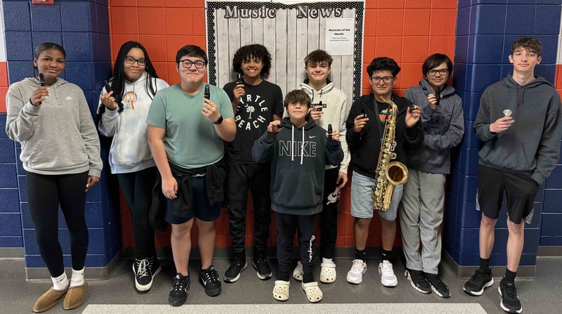 WMS students show off the new ligatures their Friends of Music grand helped purchase