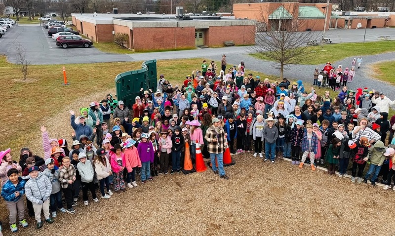 group of students celebrating new slide
