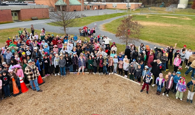 group of students celebrating new slide