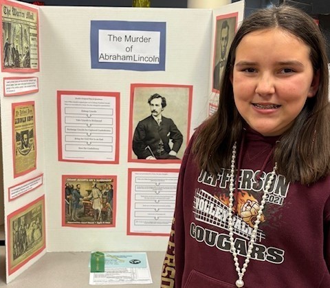 Student with their Social Studies Fair project on Abraham Lincoln