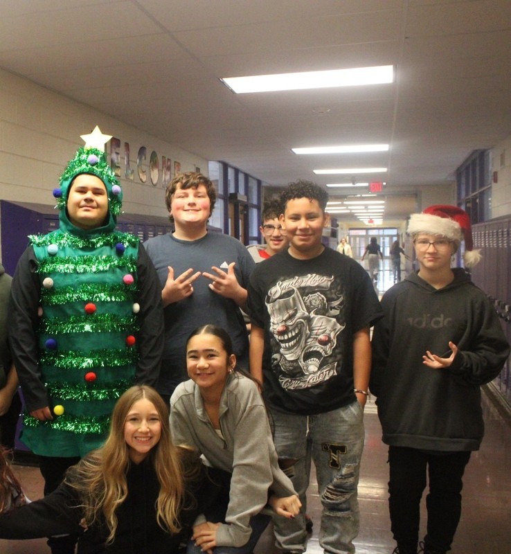 Students and staff dressed in holiday outfits