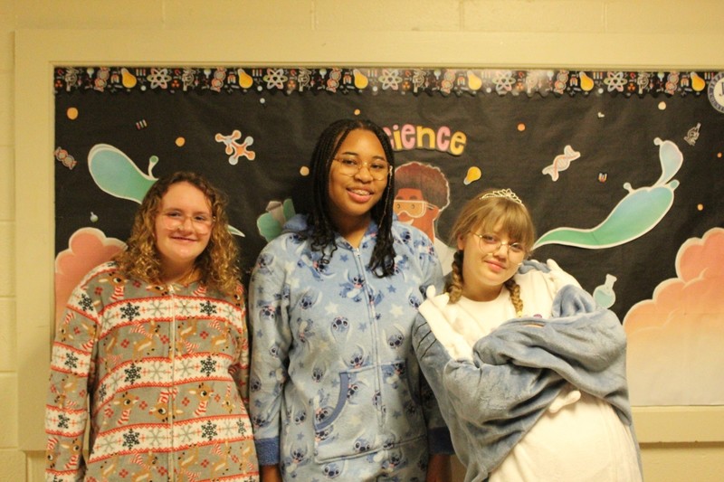 Students and staff dressed in holiday outfits