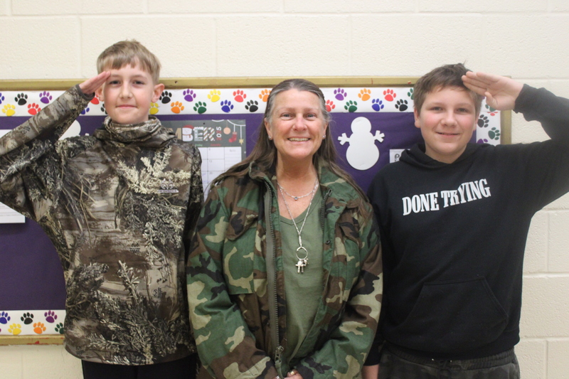 Students and staff dressed in holiday outfits