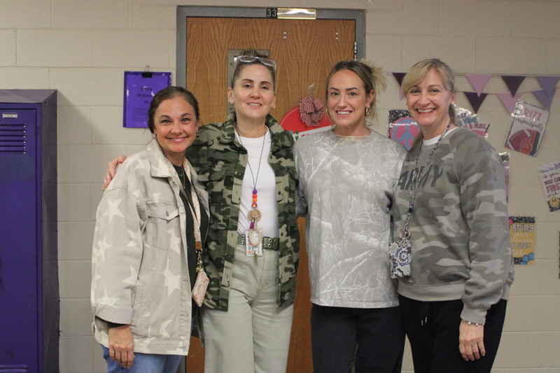 Students and staff dressed in holiday outfits