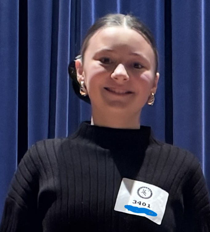 Student with their ribbon at the  county Science Fair.