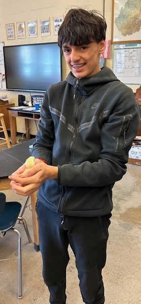 Student holding a baby chick