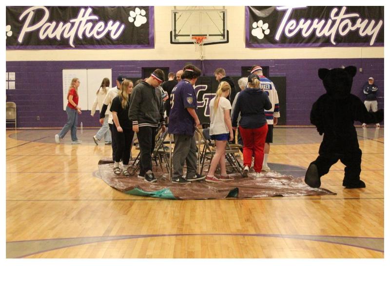 Students and staff playing Musical Chairs