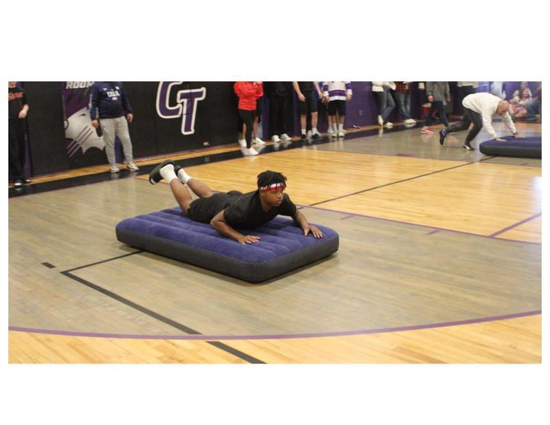 Student sliding on mattress in Mattress Race