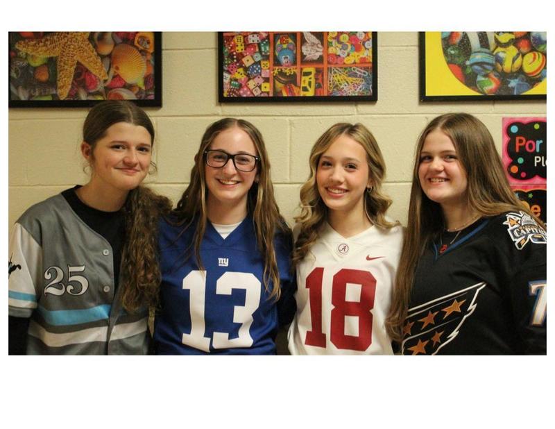 Students posing in jerseys for Jersey Day