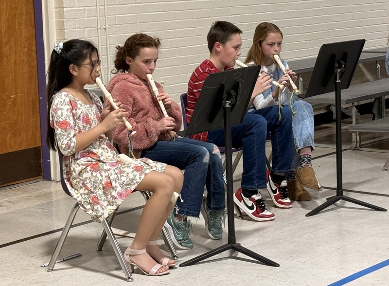 5th graders playing their recorders