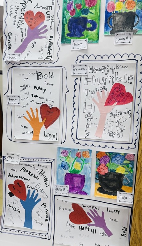 student hands and heart artwork