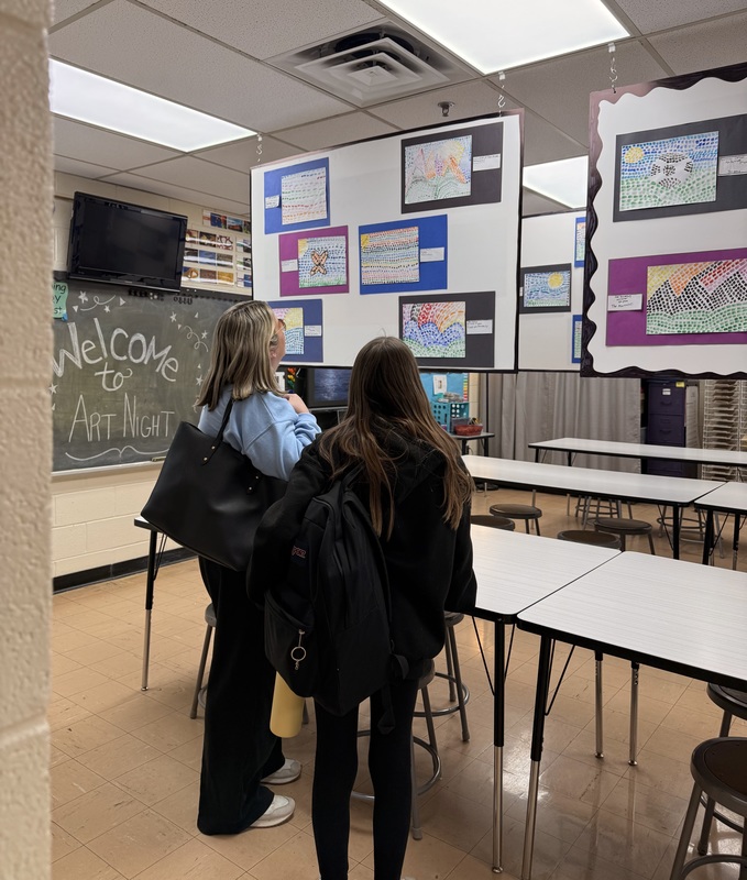 student and parent enjoying the artwork