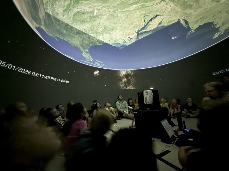 students in planetarium 