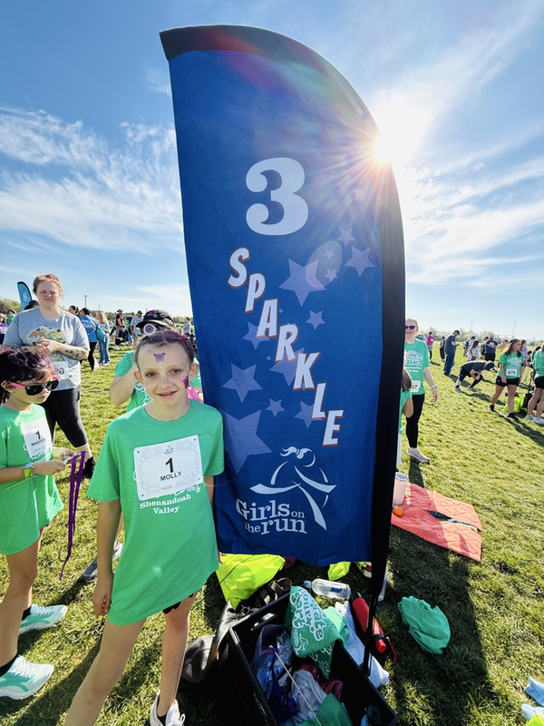 girls on the run participant with flag