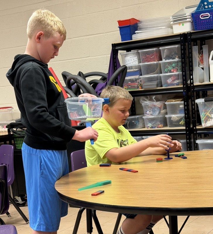 students discovering with magnets