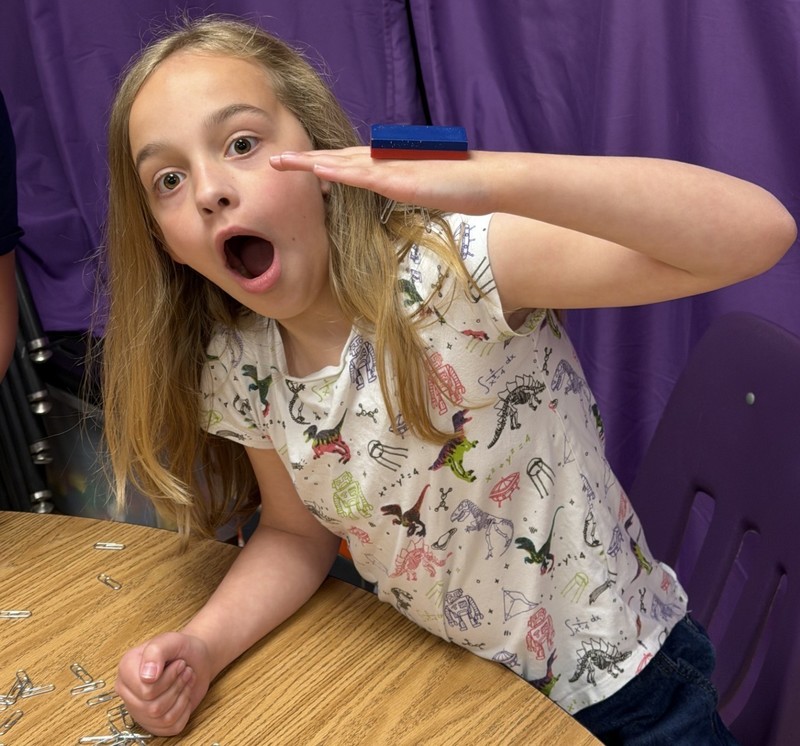 students discovering with magnets