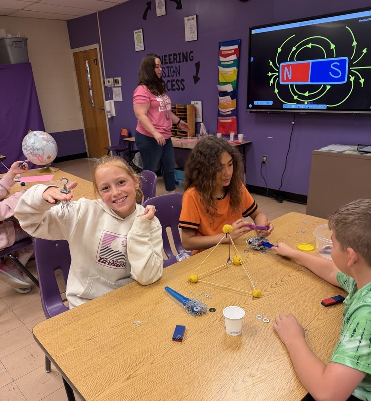 students discovering with magnets
