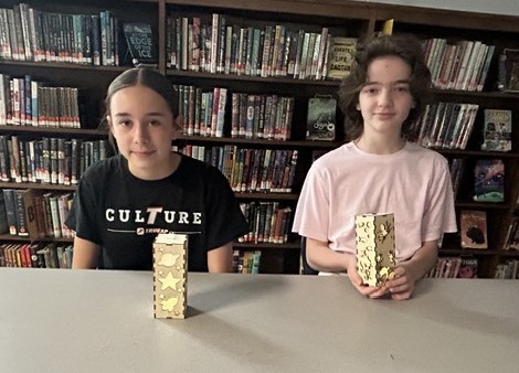 2 Students with their laser cut lanterns