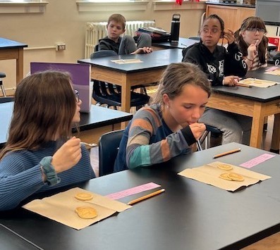 Students tasting maple syrup