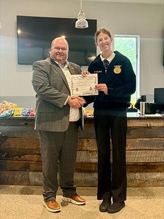 Emmalea McNeely receiving certificate