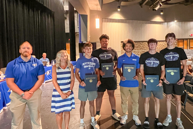 Track coaches and athletes being recognized at the July 15th board meeting